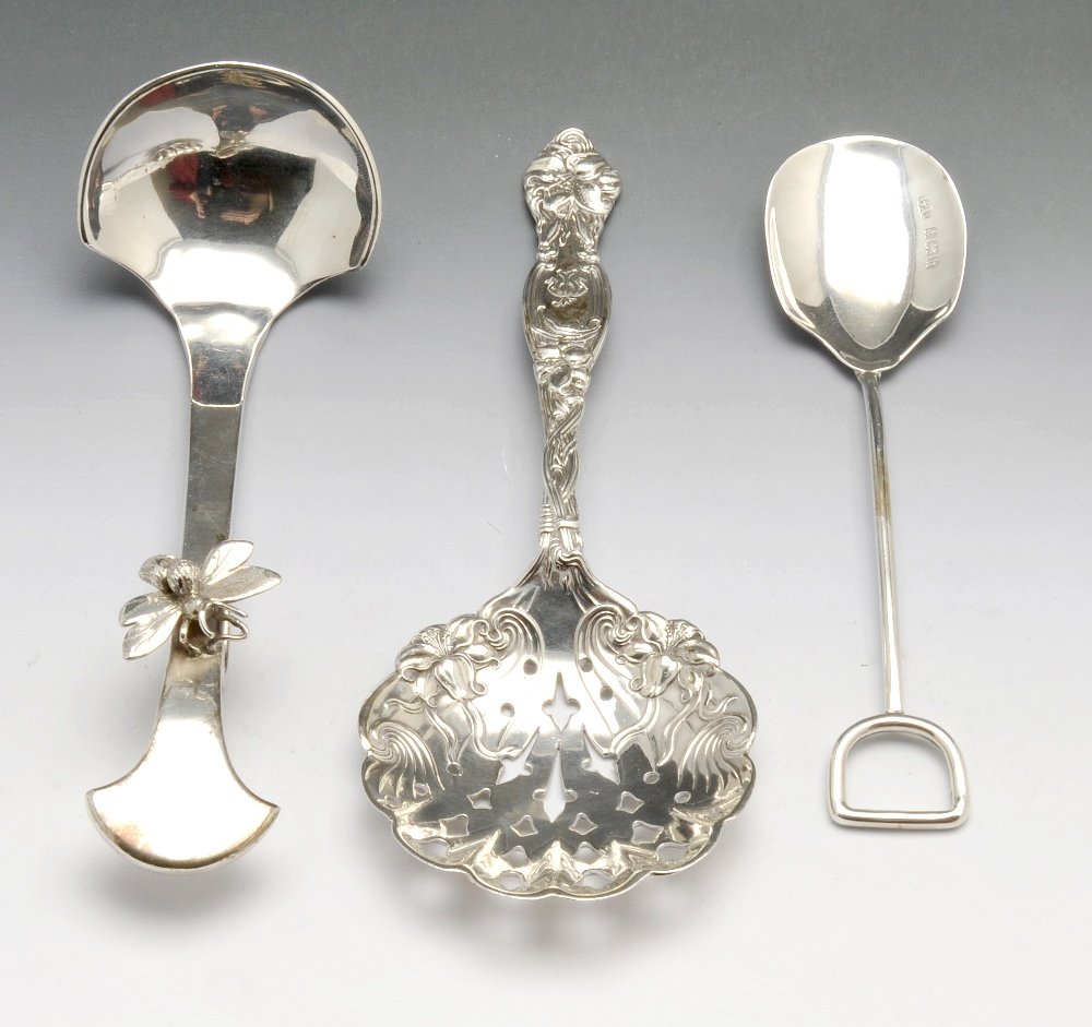 A collection of spoons & ladles.: A modern silver preserve spoon of plain shaped form with realistically modelled fly to the front and hook to the stem, hallmarked Amanda Birkett, London 1997. Together with a pair of 1940's silver sau