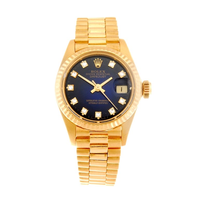 (86590) A 18k gold automatic lady's Rolex Datejust: (86590) ROLEX - an 18k gold automatic lady's Oyster Perpetual Datejust bracelet watch circa 1980, the blue graduated dial with hourly applied diamond dot markers, date aperture set to three o'clock, b