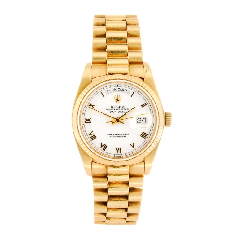 (118633) An 18k gold automatic gentleman's Rolex: (118633) ROLEX - an 18k gold automatic gentleman's Oyster Perpetual Day-Date bracelet watch circa 1984, the white dial with hourly applied gilt Roman numerals, day and date apertures positioned to twe