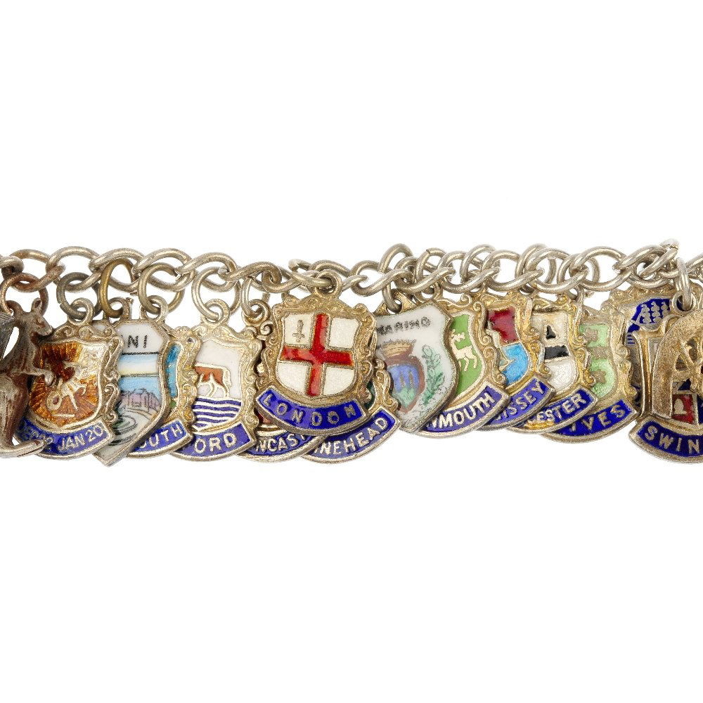A selection of four charm bracelets.: A selection of four charm bracelets. The four curb-link chains, suspending a total of sixty-seven charms including an enamel London Transport sign. One clasp with silver hallmarks for Birmingham, 1963