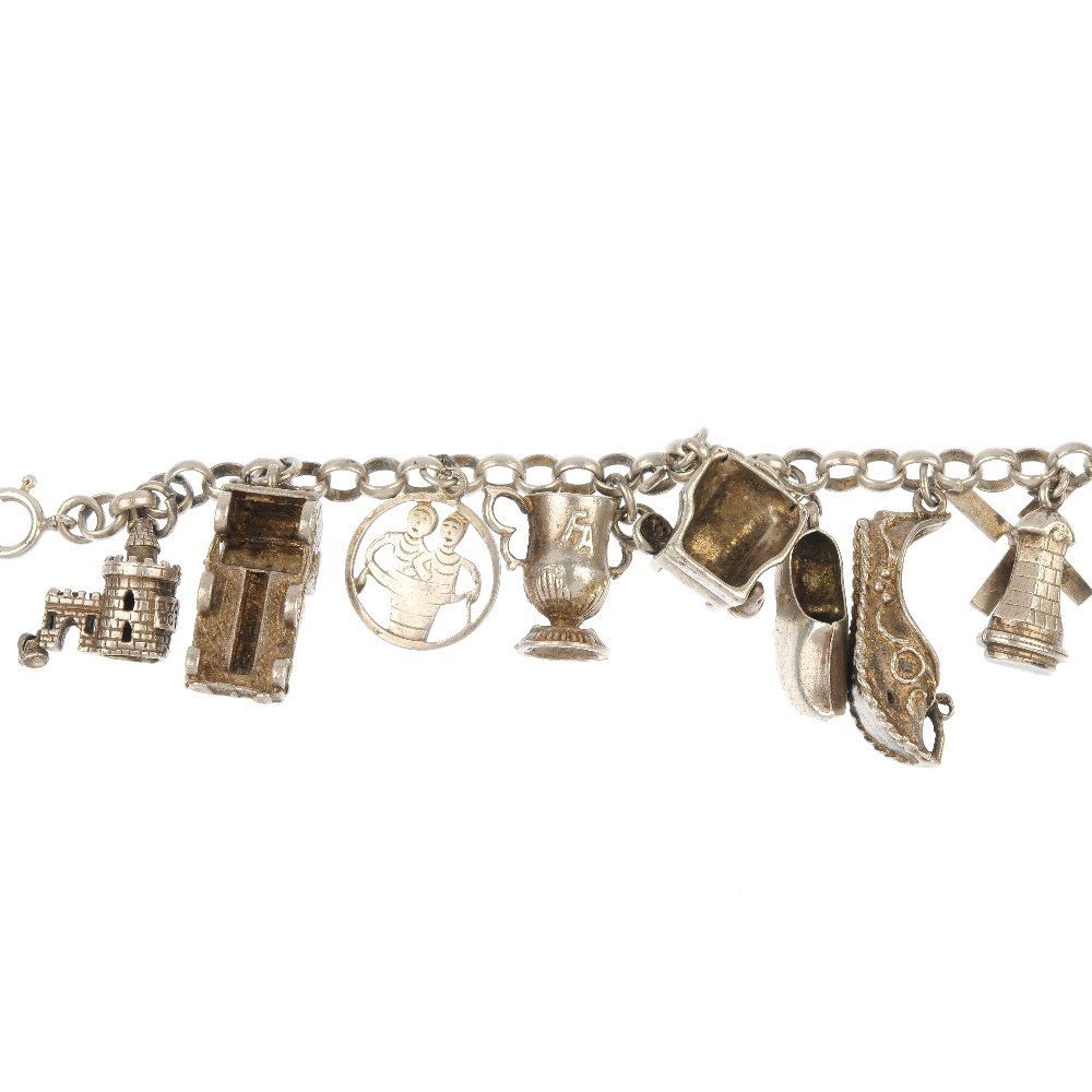 A selection of four charm bracelets.: A selection of four charm bracelets. The four curb and belcher-link chains, suspending a total of sixty-six charms including an enamel porter carrying a ladder, together with a figaro-link bracelet an