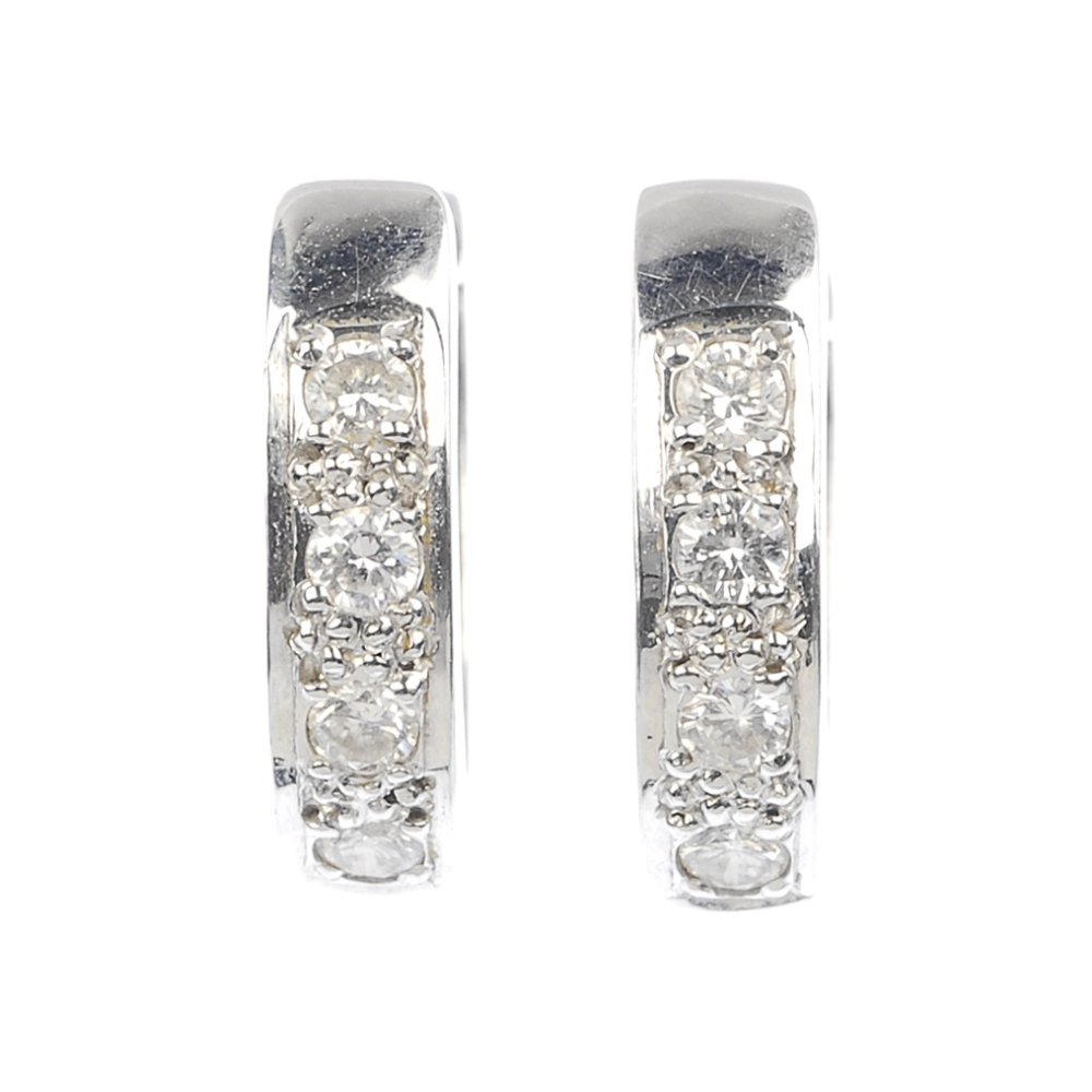 A pair of diamond ear hoops.