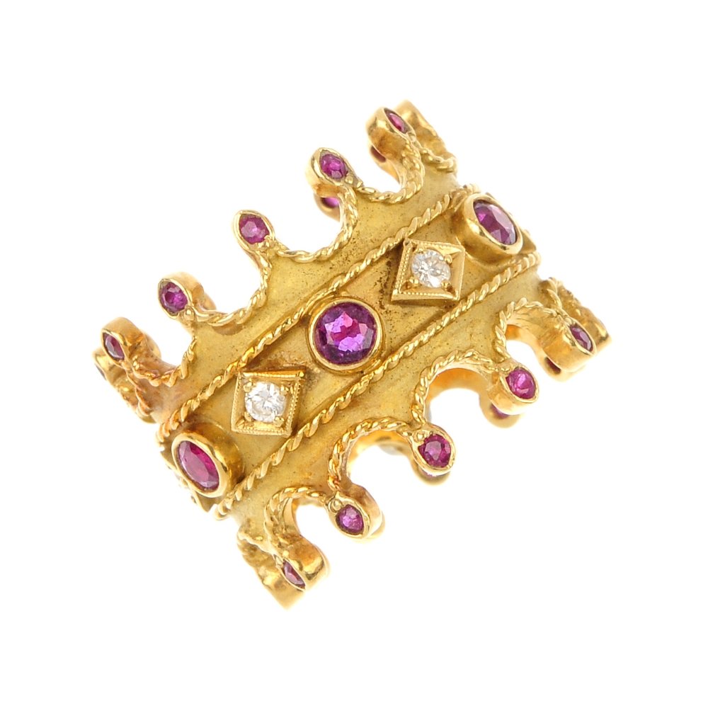 A 1970s 18ct gold ruby and diamond novelty ring.: A 1970s 18ct gold ruby and diamond novelty ring. Designed as a stylised crown, the circular-shape ruby collet and brilliant-cut diamond alternating line, to the rope-twist crenulations with circular-s