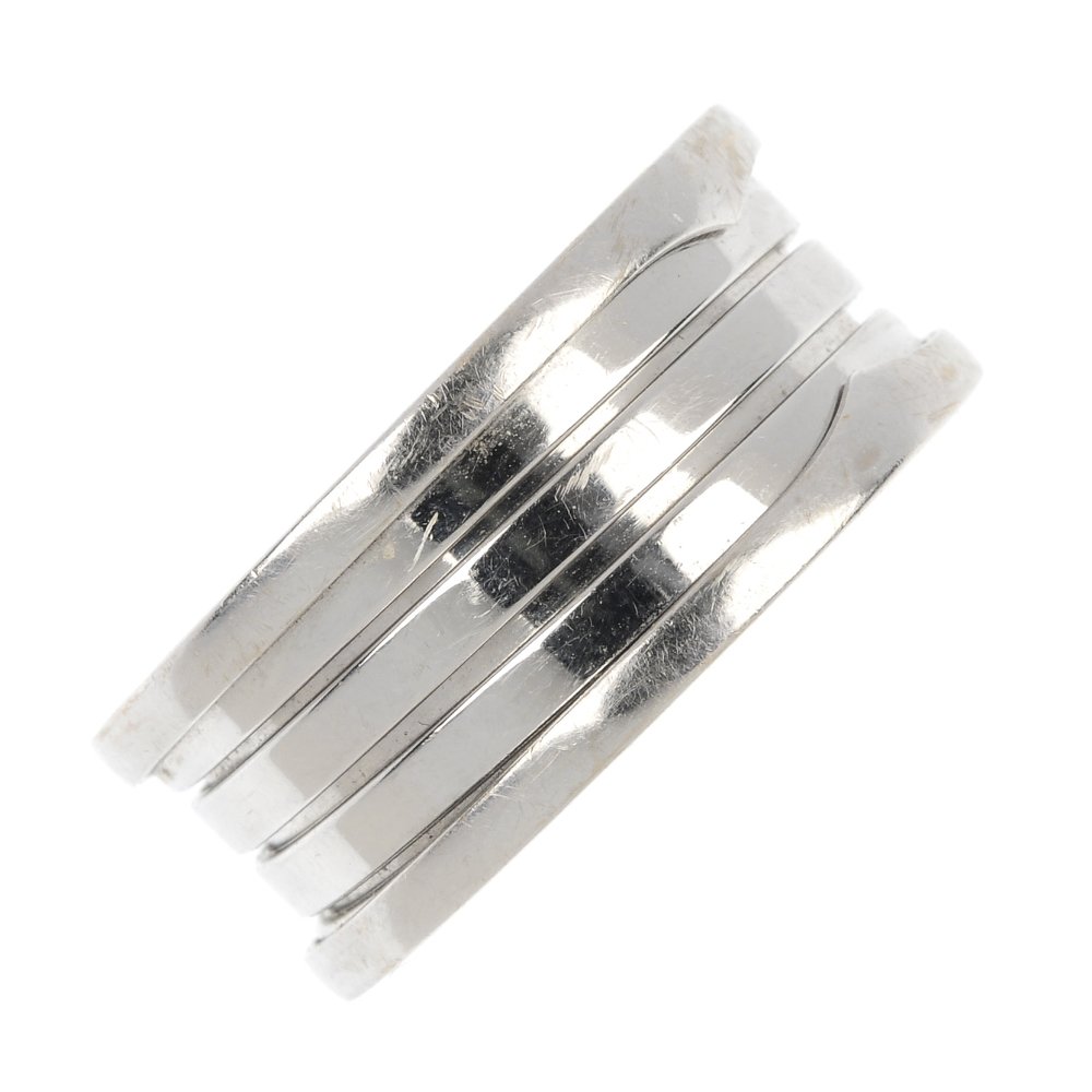 BULGARI - a 'B. Zero 1' ring.: BULGARI - a 'B. Zero 1' ring. The coiled band, to the Bulgari motif sides. Signed Bulgari. Ring size X. Weight 13.9gms.