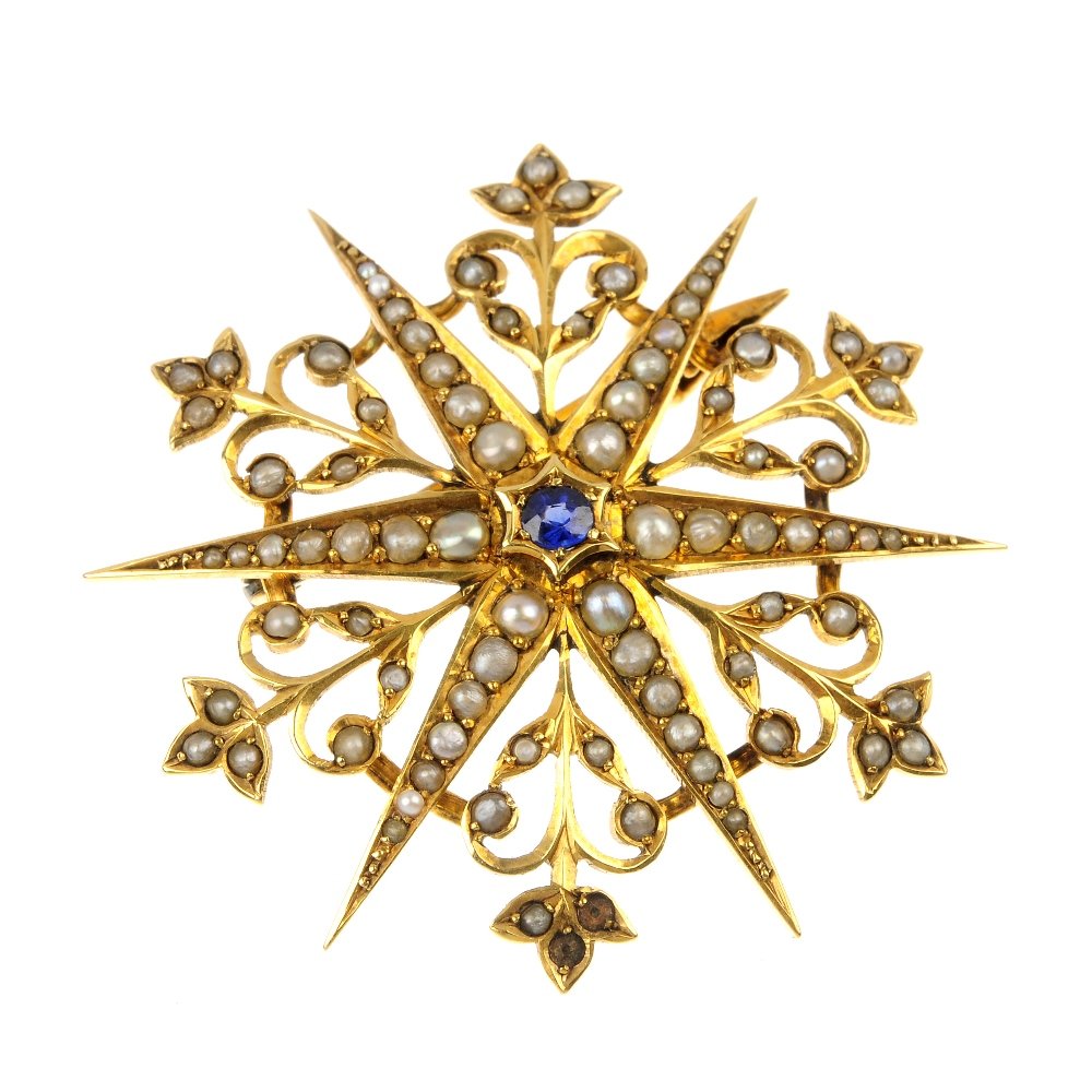 An Edwardian 9ct gold sapphire and seed pearl star broo: An Edwardian 9ct gold sapphire and seed pearl star brooch. The circular-shape sapphire, within a six-rayed seed pearl star surmount, with seed pearl foliate detail. Hallmarks for Chester, 1905. Diamet