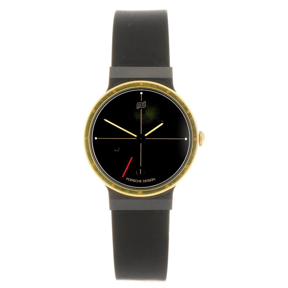 A bi-metal quartz gentleman's Porsche Design Ultra: PORSCHE DESIGN - a bi-metal quartz Ultra Sport gentleman's wrist watch, the black dial with gold crosshair design, quarterly luminous markers, date aperture to six o'clock, round case numbered 2356541