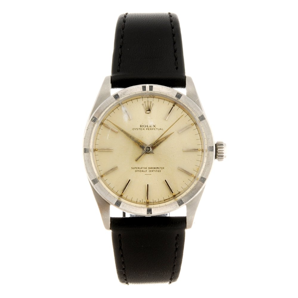 A stainless steel automatic gentleman's Rolex Oyster: ROLEX - a stainless steel automatic gentleman's Oyster Perpetual wrist watch circa 1964, the silvered dial with applied hour batons, bordered by a minute track, engine turned bezel, tonneau shaped cas