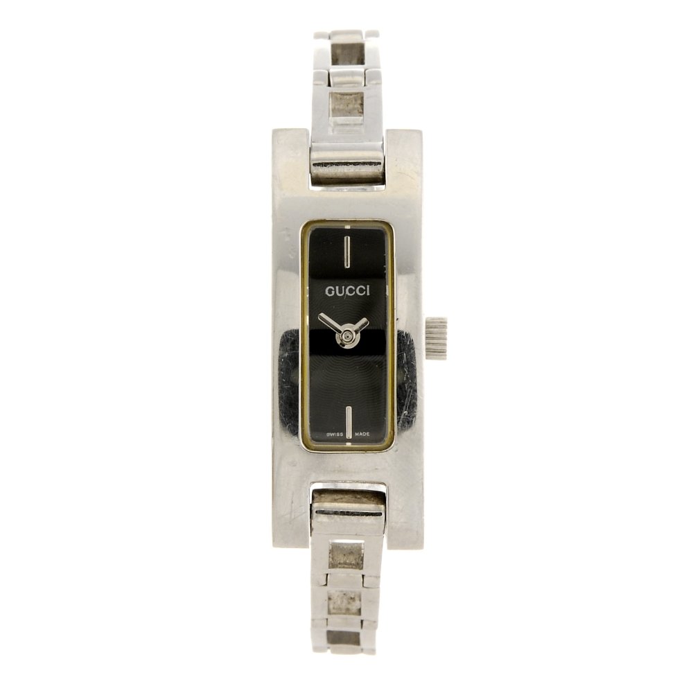 A stainless steel quartz lady's Gucci 3900L bracelet: GUCCI - a stainless steel quartz lady's 3900L bracelet watch, the black guilloch? effect dial with silvered batons to twelve and six o'clock, rectangular case, fitted to a steel link bracelet with fol