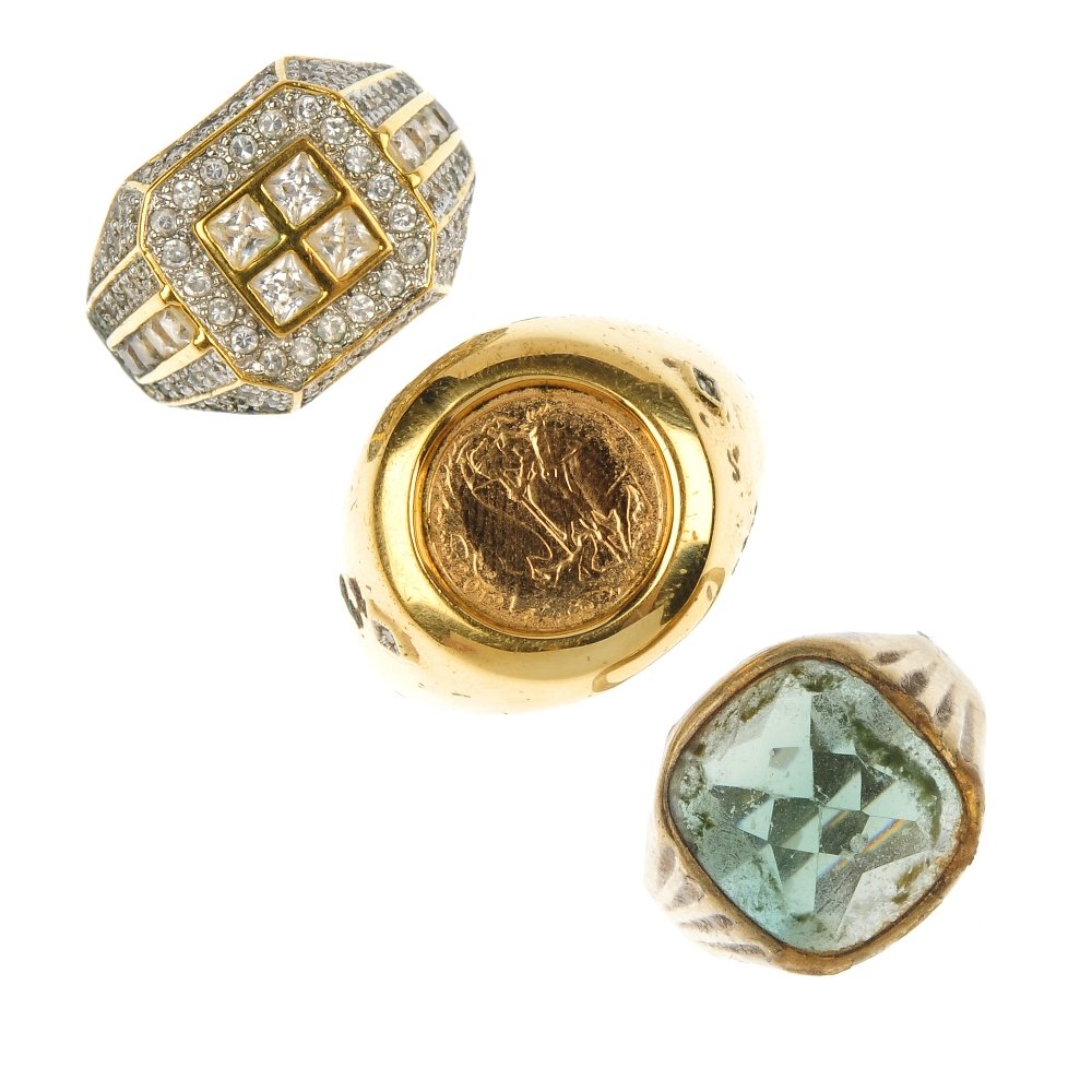 Two gentleman's dress rings.: Two gentleman's dress rings. To include a plated ring set with a 22ct gold coin, a paste cluster ring, together with one further ring. Total weight 20.8gms.