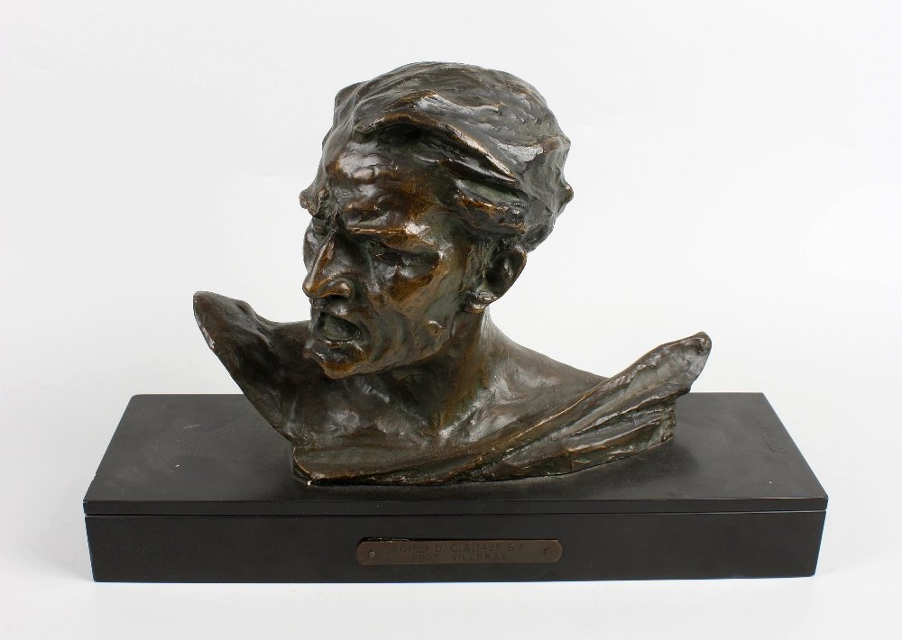 A 20th century bronze bust of a male: A 20th century bronze bust of a male mounted upon a polished black slate base, engraved R. Varnier, the front with applied brass plaque "401 EME DCA 142 E B/E Fort Villeras". Base 15.75" (40cm) wide, 