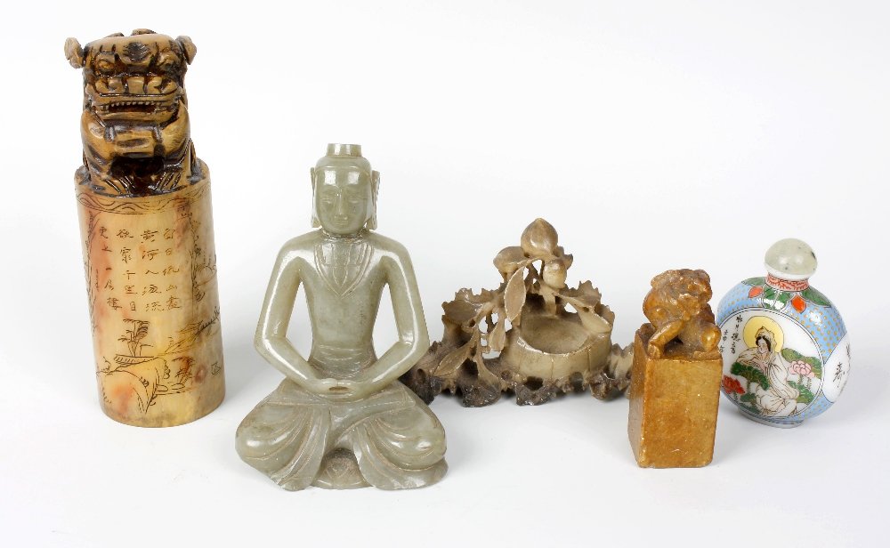 A box containing a carved Jadeite figure of an eastern : A box containing a carved Jadeite figure of an eastern goddess, 4 1/2" (11cm) high. A carved soapstone brush pot, similar seal moulded with a Dog of Fo, etc.
