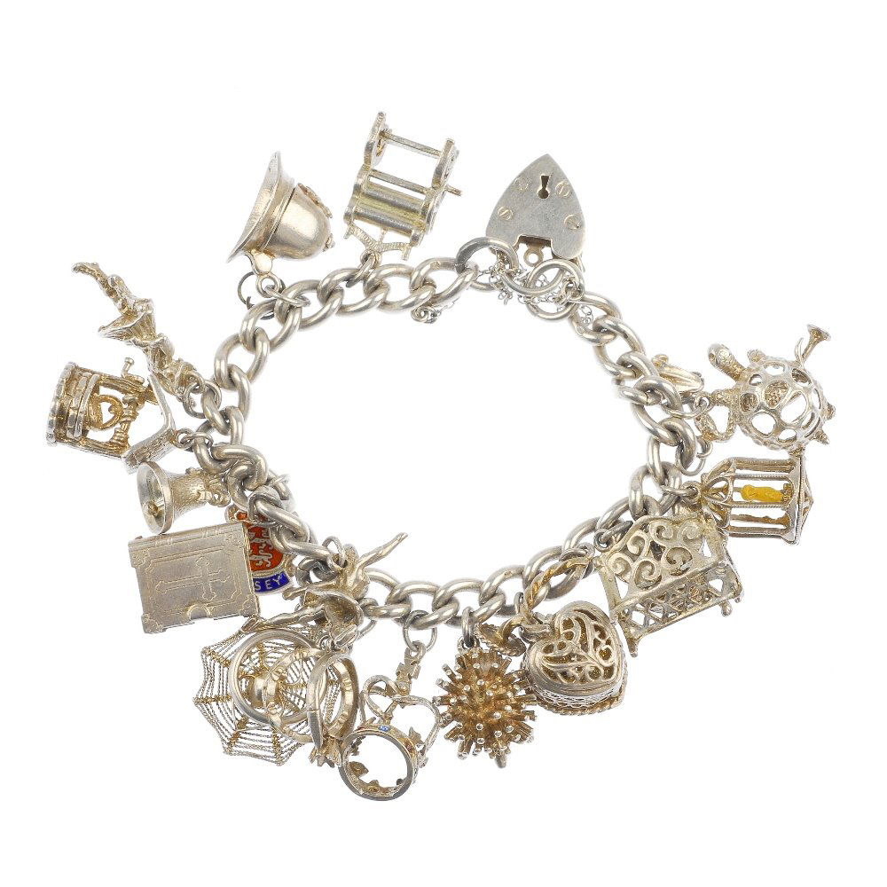 A selection of three silver and white metal charm: A selection of three silver and white metal charm bracelets, to include a silver curb-link bracelet, suspending fifteen charms, to include a paste peacock. Forty-two charms in total. Bracelets and eig