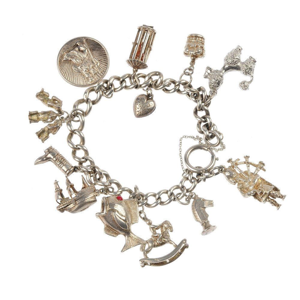 A selection of three silver charm bracelets.: A selection of three silver charm bracelets, designed as a series of fifty-seven charms, to include a beach hut, a pretzel and a Scotsman playing the bagpipes, to the curb and trace-link chains. Lengt