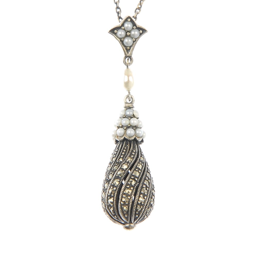 A silver brooch and marcasite pendant.: A late Victorian silver brooch designed as a basket of flowers, together with a silver marcasite spiral drop and seed pearl pendant suspended from a trace-link chain. Hallmarks for Birmingham, 1884. L