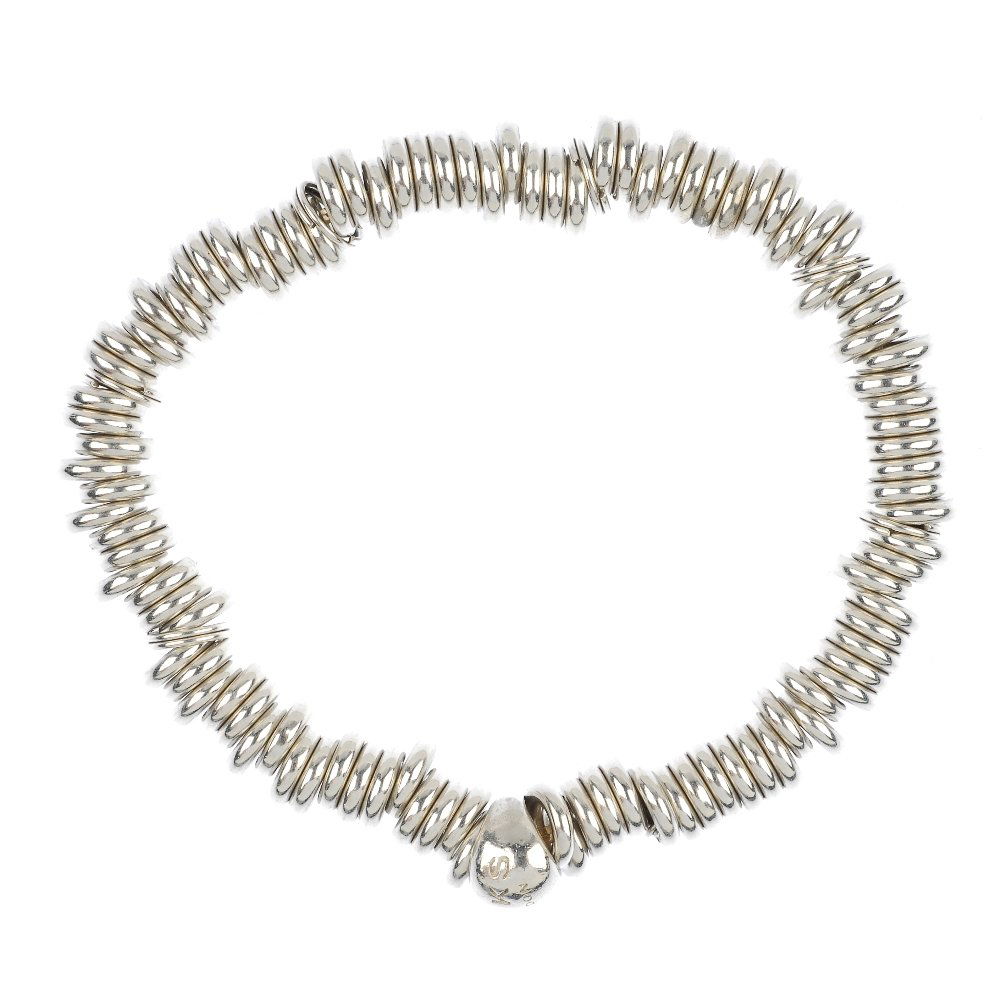 LINKS OF LONDON - three 'Sweetie' bracelets.: LINKS OF LONDON - three 'Sweetie' bracelets, suspending a non-designer paste and enamel shoe charm. Bracelets with maker's marks for Links of London and hallmarks for silver. Weight 187gms.