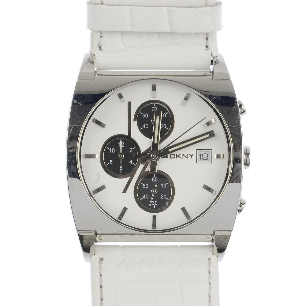 Two lady's designer wristwatches.: Two lady's designer wristwatches, to include a Gucci wristwatch, with brown leather wrap around strap and a DKNY wristwatch, the white dial, to the white leather strap. With maker's boxes.