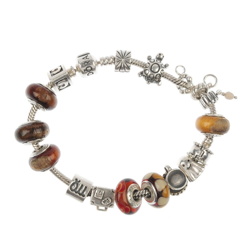 Three designer bracelets.: Three designer bracelets, to include two Pandora charm bracelets and an Emporio Armani silver belcher-link bracelet, suspending three plastic charms. Maker's marks for Pandora and Emporio Armani. With