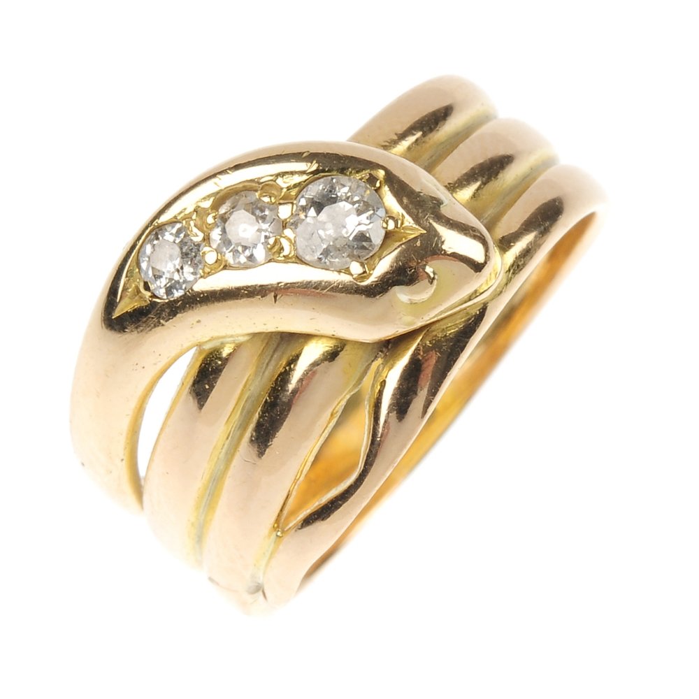 An Edwardian 18ct gold diamond snake ring.: An Edwardian 18ct gold diamond snake ring. Designed as a coiled snake, with graduated old-cut diamond crest. Estimated total diamond weight 0.30ct. Hallmarks for London, 1903. Weight 7.3gms.