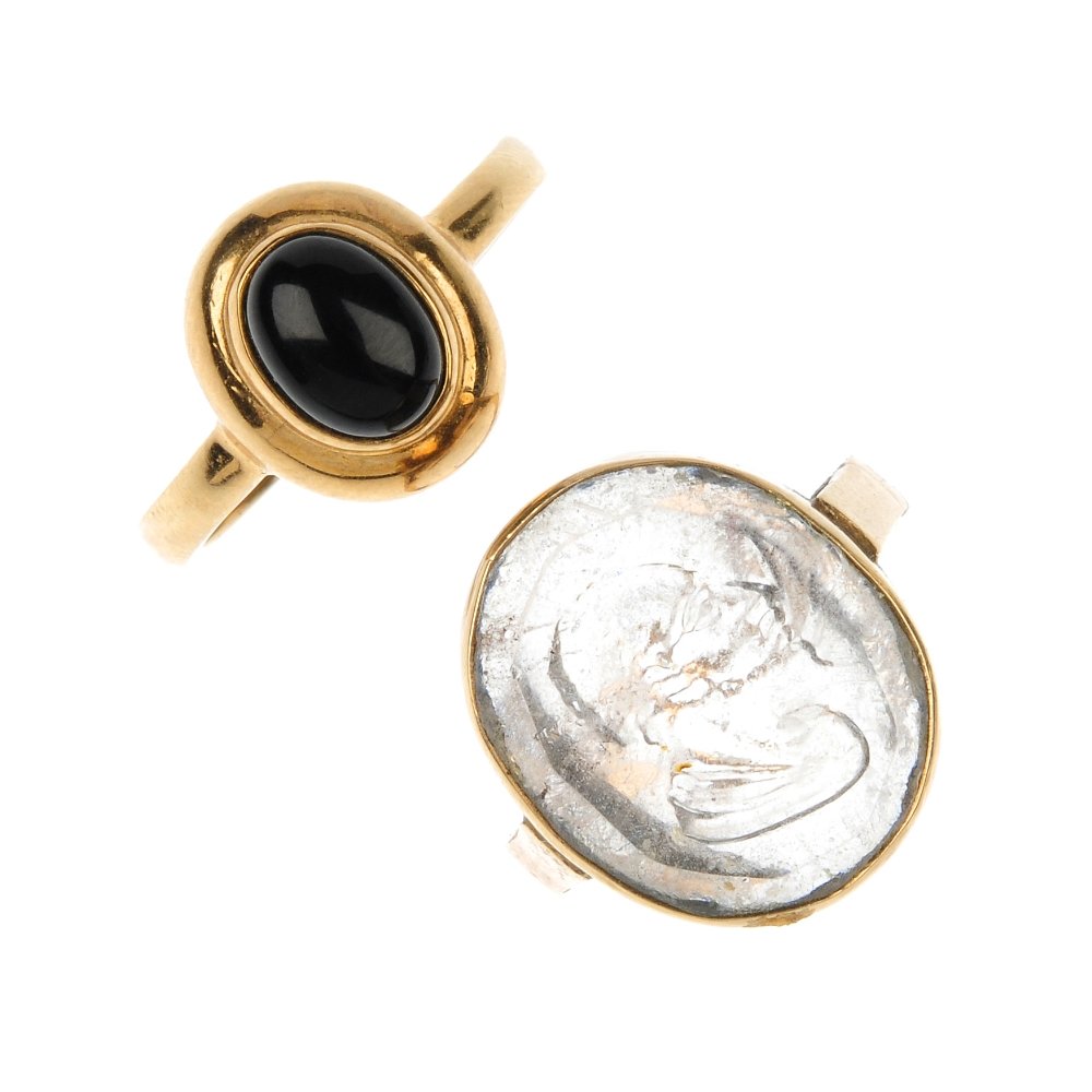 A selection of four gem-set rings.: A selection of four gem-set rings. To include a 9ct gold carnelian cameo ring, a 9ct gold oval opal cabochon ring, a 9ct gold oval onyx cabochon ring and a moulded colourless glass intaglio ring. Thre