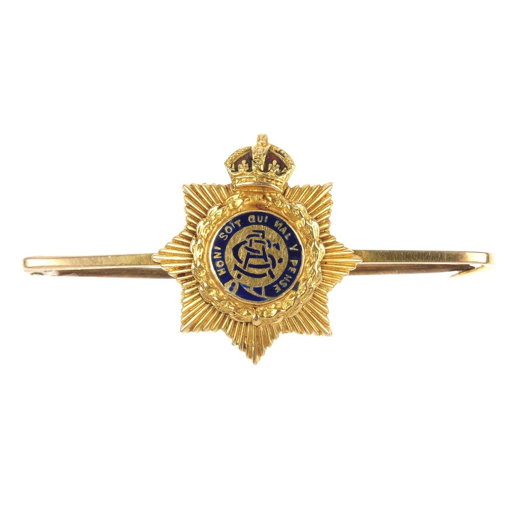 An Edwardian diamond ring and a Army service corps regi: An Edwardian diamond ring and a mid 20th century Army service corps regimental brooch. To include an 18ct gold rose-cut diamond five-stone ring and a 15ct gold Army service corps blue enamel bar brooc