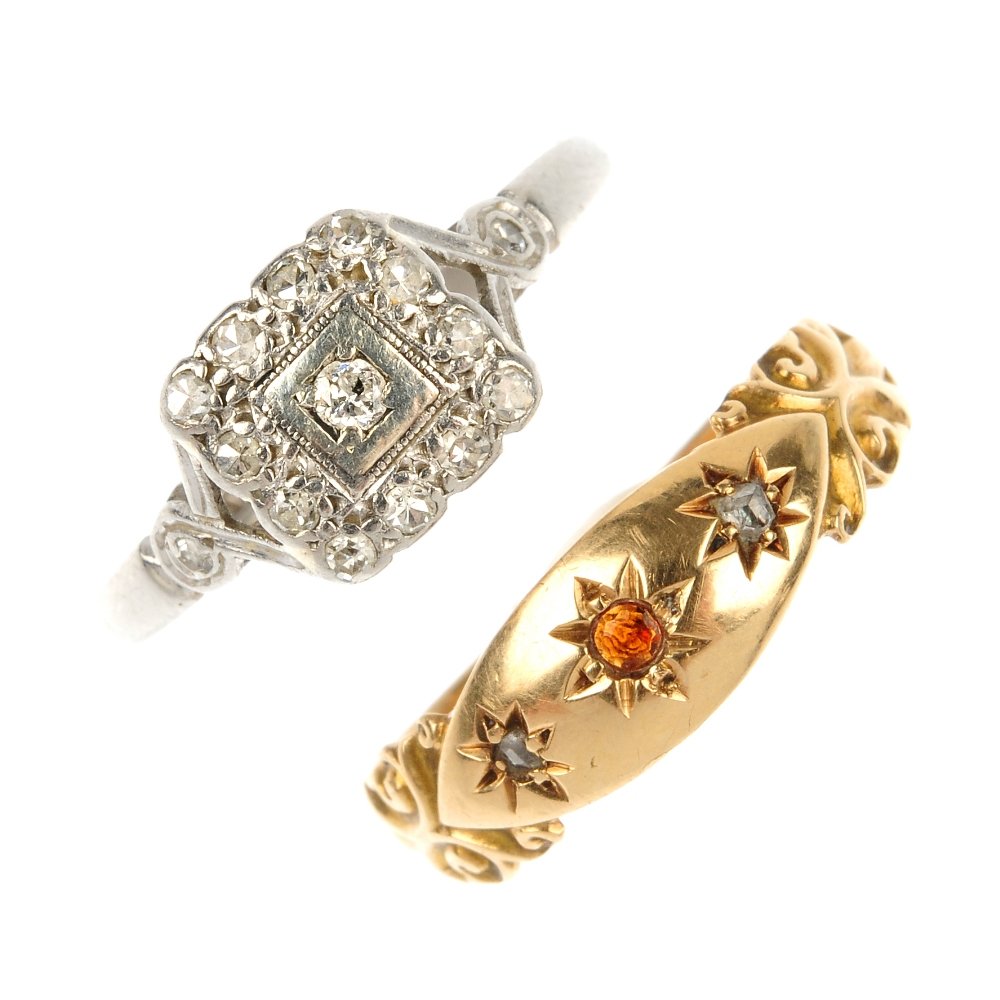 Two early to mid 20th century gem-set dress rings.: Two early to mid 20th century gem-set dress rings. To include a 15ct gold garnet and diamond three-stone ring and a platinum vari-cut diamond cluster ring. One with hallmarks for Birmingham, 1917. Wei