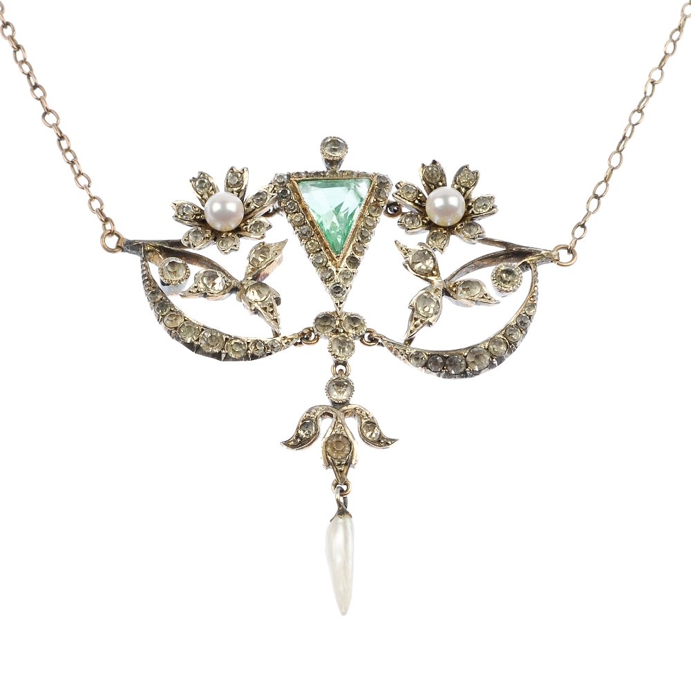 An early 20th century continental silver paste and: An early 20th century continental silver paste and cultured pearl floral pendant. Of openwork design, the triangular-shape green paste, flanked by cultured pearl and colourless paste flowers, to the s