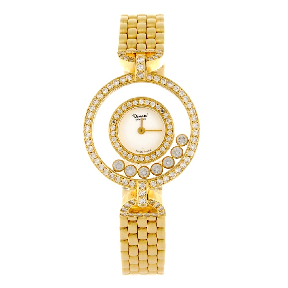 An 18k gold quartz lady's Chopard Happy Diamonds: CHOPARD - an 18k gold quartz lady's Happy Diamonds bracelet watch, the plain white dial, diamond set case with seven free play diamonds inside glass chapter ring, numbered 295759 4097, fitted to an 18