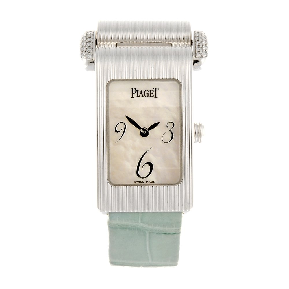 (531643-3-A) An 18k white gold quartz lady's Piaget: (531643-3-A) PIAGET - an 18k white gold quartz lady's Miss Protocole wrist watch, the mother-of-pearl dial with quarterly Arabic numerals, rectangular case numbered 5322 889954, diamond set lug, fitte