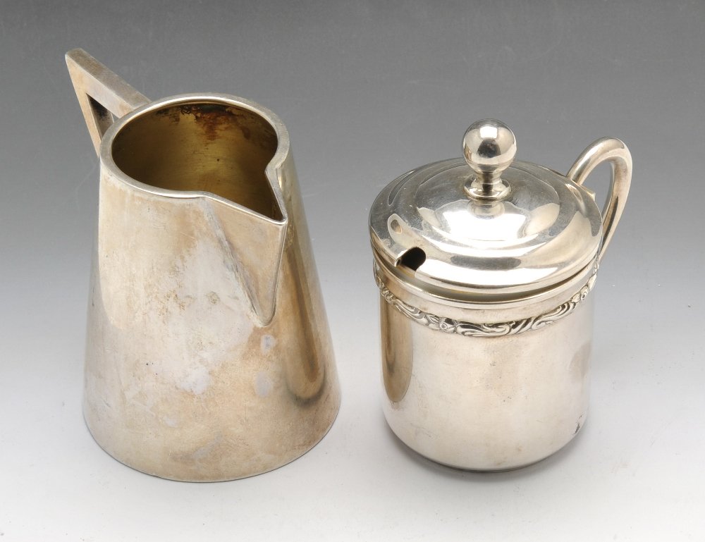 A German Art Deco cream jug, mustard & continental: A German Art Deco cream jug, together with a German mustard pot by Lutz & Weiss, both with German Reichsmark and standard mark of 800 and a further continental waiter, stamped 800. Gross weight 8.1 oz