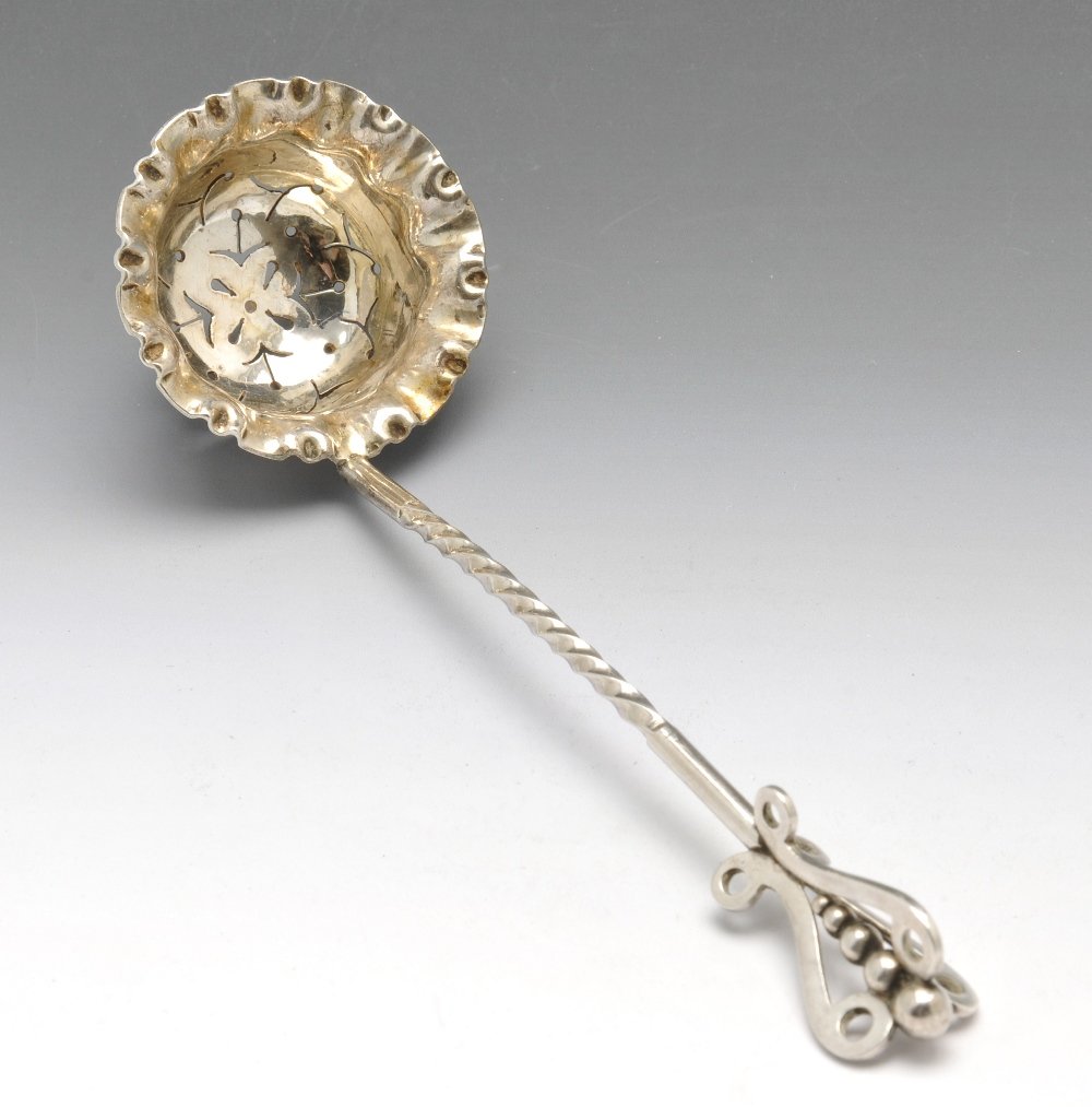 A Victorian sifter spoon, Edwardian caddy spoon &: A Victorian silver sifter spoon with twist stem and bead and scroll terminal, hallmarked Hilliard & Thomason Birmingham 1894, length measuring 6 inches (15 cm). Together with an Edwardian silver caddy