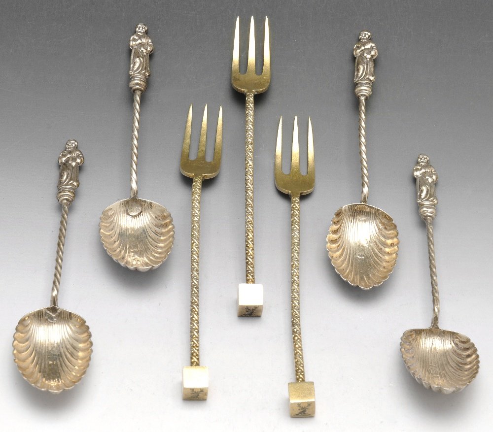 A group containing Edwardian apostle spoons, Victorian: An Edwardian set of ten silver apostle top spoons, each with a spiral twist stem leading to a shell bowl, hallmarked William Devenport, Birmingham 1901. Together with a set of six late Victorian silve