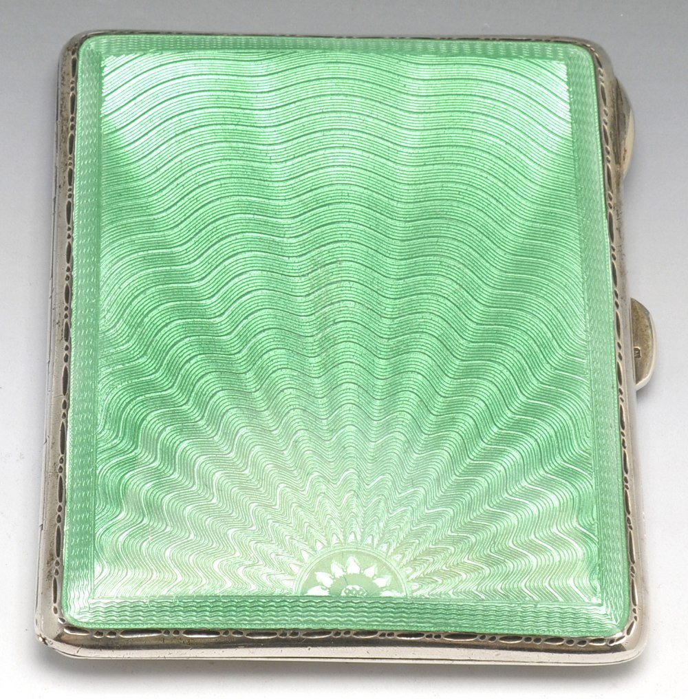 A 1930's silver cigarette case.: A 1930's silver cigarette case of oblong form, the front case with green guillochï¿½ enamel, engraved border and opening to reveal a silver-gilt interior. Hallmarked Hardy Brothers, Birmingham 1938