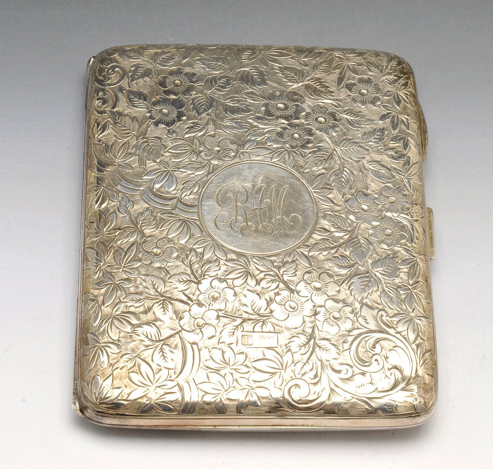 An Edwardian silver cigarette case.: An Edwardian silver cigarette case, both sides with scrolling floral engraving, with monogrammed circular cartouche. Hallmarked Deakin & Francis Ltd, Birmingham 1903. Length 4 1/16 inches (10.4 cm). W