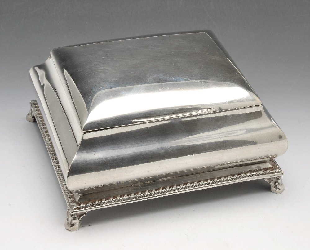 An early twentieth century silver trinket box.: An early twentieth century silver trinket box, the oblong shaped form with gadrooned rim and silver-gilt interior. Hallmarked Walker & Hall, further marks distorted. Length measuring 4 inches (10 cm),
