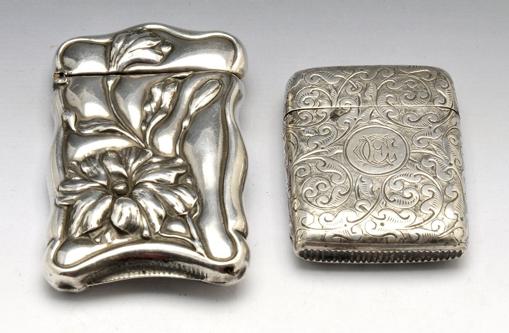 Two silver vesta cases.: Two silver vesta cases, to include a late Victorian foliate engraved vesta with monogrammed circular cartouche, hallmarked *E, Birmingham 1887, together with another vesta case, stamped sterling. Heig