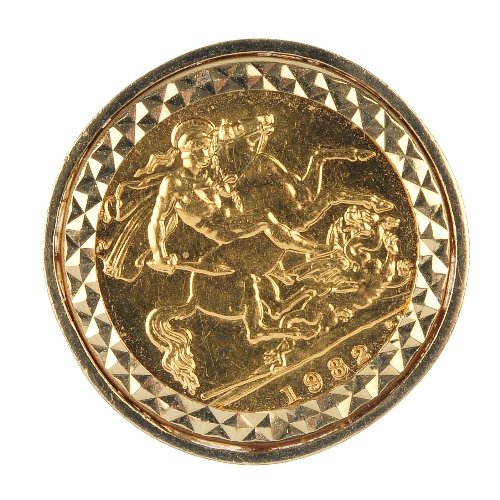 A 9ct gold mounted half sovereign ring.: A 9ct gold mounted half sovereign ring. The half sovereign coin, within a textured border, to the openwork lattice shoulders and plain band. Mount with hallmarks for London, 1990. Total weight 7.7gms.