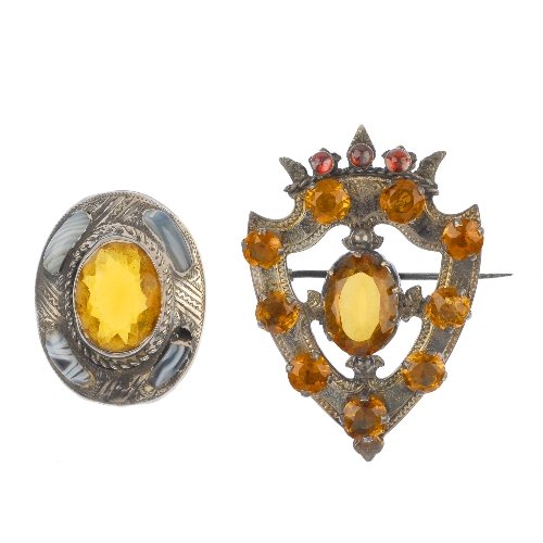 A selection of late 19th century silver brooches.: A selection of late 19th century silver brooches, to include a late Victorian Scottish silver citrine shield-shape brooch, a paste oval-shape brooch, together with an anchor brooch. The first with Vic
