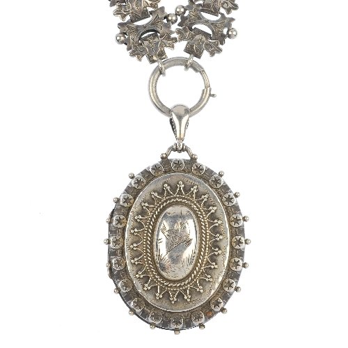 A late 19th century silver floral locket: A late 19th century silver floral locket, of oval outline, the floral engraved front panel, to the bead border, suspended from a tapered surmount and wide belcher-link chain. Hallmarks for Birmingham,