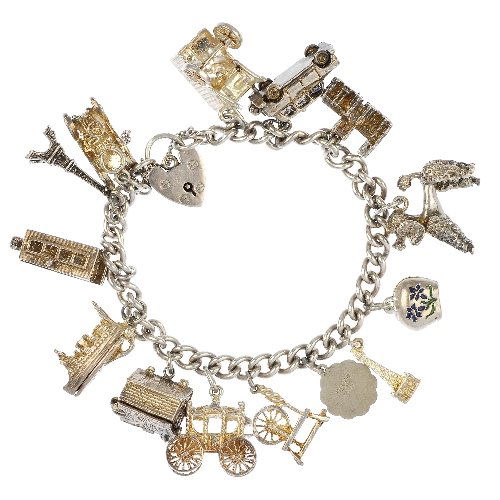A selection of eight silver and white metal charm: A selection of eight silver and white metal charm bracelets and charms, the curb-link bracelets suspending a total of 128 charms, to include a poodle, a gramophone and a motor bike. Most with marks to