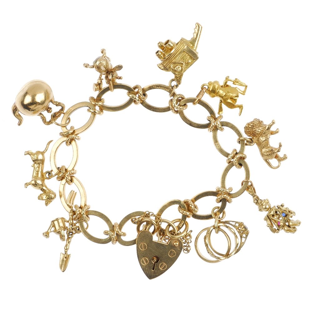 (26637) An assortment of jewellery: (26637) An assortment of jewellery. Comprising seven variously designed and gem-set rings, three pairs of ear pendants, three vari-link bracelets and a charm bracelet together with three vari-link nec