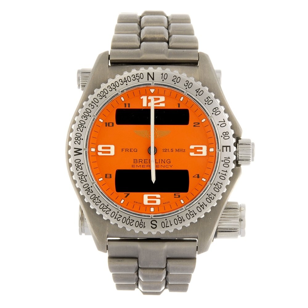 A titanium quartz gentleman's Breitling Emergency: BREITLING - a titanium quartz gentleman's Emergency bracelet watch circa 2002, the orange dial with Arabic numeral hour markers and digital displays to twelve and six o'clock, calibrated compass bezel