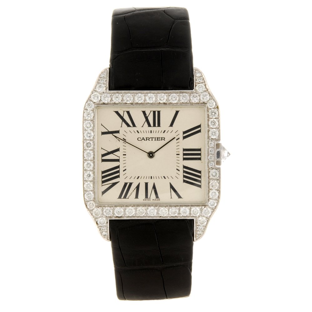 An 18k white gold manual wind Cartier Santos Dumont: CARTIER - an 18k white gold manual wind Santos Dumont wrist watch, the silvered dial with hourly applied black Roman numerals, inner minute track, H shaped diamond afterset case, numbered 2651 625553N