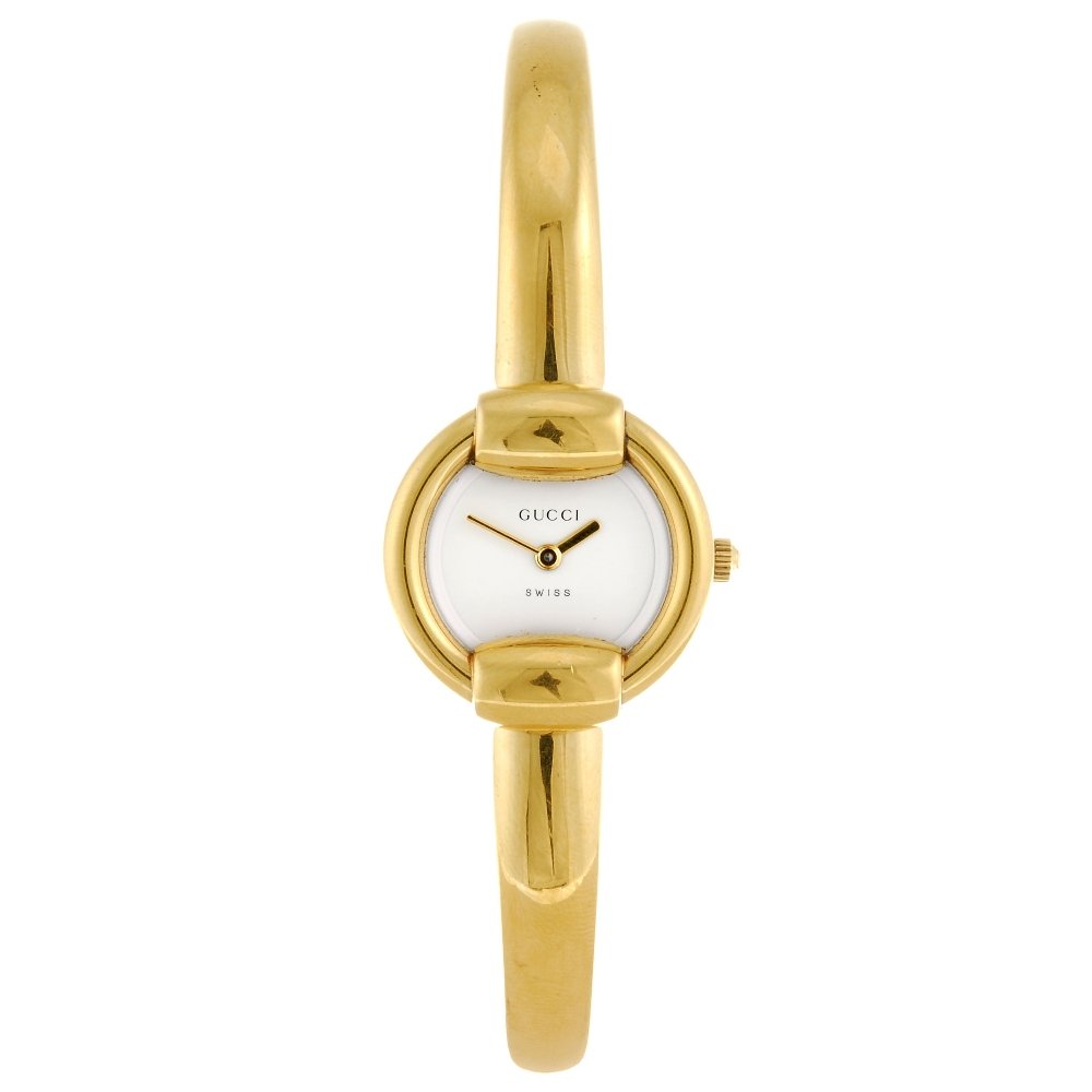 A gold plated quartz lady's Gucci 1400L 