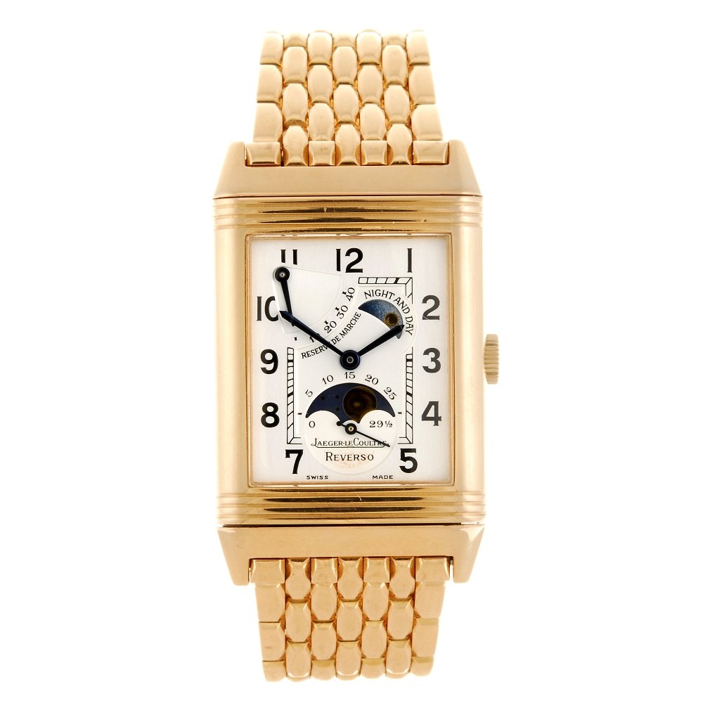 An 18k gold manual wind gentleman's Jaeger-LeCoultre: JAEGER-LECOULTRE - an 18k gold manual wind gentleman's Reverso Night and Day bracelet watch, the silvered dial with hourly applied black Arabic numerals, inner minute track, subsidiary seconds dial an