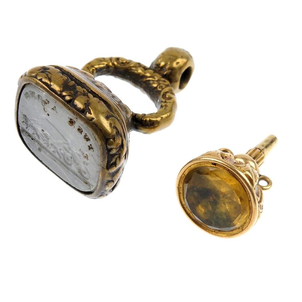 A selection of four fobs, a watch key and a pendant. : A selection of four fobs, a watch key and a pendant. To include three late 19th century fobs, a late 19th century citrine watch key and carnelian pendant, together with an early 20th century citrine s