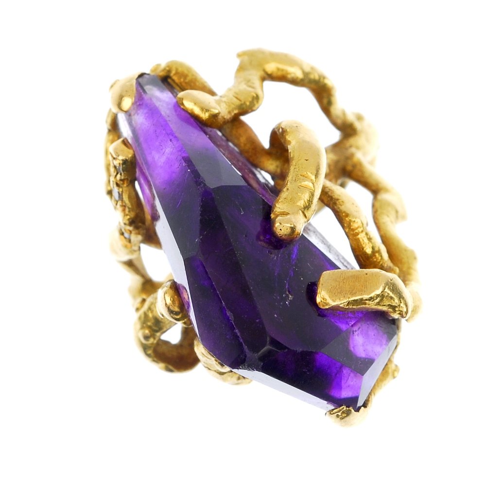 (124514) GRIMA- an 18ct gold amethyst and diamond dress: (124514) GRIMA- an 18ct gold amethyst and diamond dress ring. The trigonal-shape crystal amethyst within jagged branch shoulders and brilliant-cut diamond pave detail to the branch-like band. Signed G