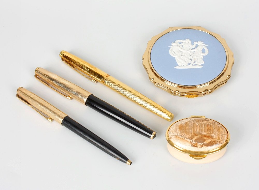 A box containing a Parker Duofold fountain pen: A box containing a Parker Duofold fountain pen with 14k gold nib, other various pens, an Old hall Staffordshire enamels limited edition oval pill box decorated with a scene of Rackhams, Birmingham, to