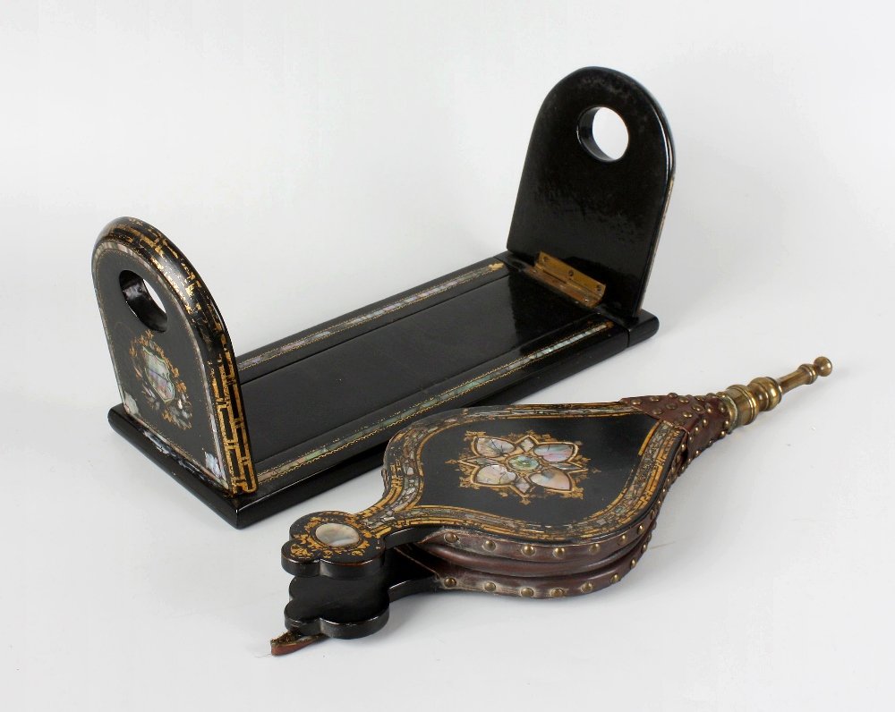 A pair of 19th century black laquered papier mache: A pair of 19th century black lacquered papier mache bellows, the fronts with inlaid abalone shell, and gilded decoration, 16.25" (41cm) long. Together with a set of similar folding and extendable book