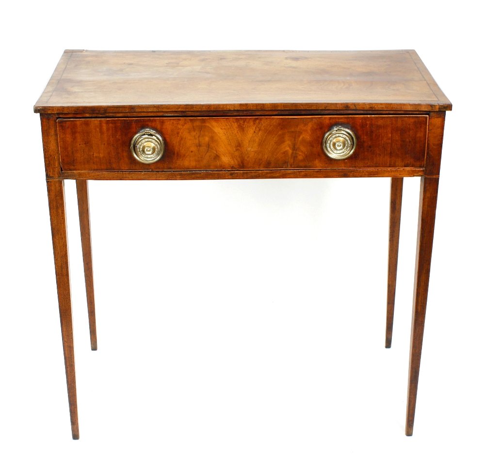A 19th century mahogany side table: A 19th century mahogany side table, the rectangular top above a front fitted with a single narrow frieze drawer, with brass drop hoop ring handles and block tapered supports. 31" wide x 30 1/2" high, 