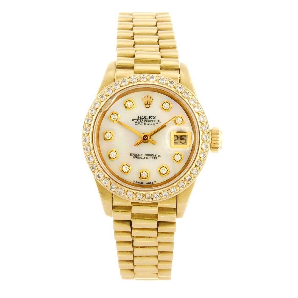 (913001988) An 18k gold automatic lady's Rolex Datejust: (913001988) ROLEX - an 18k gold automatic lady's Oyster Perpetual Datejust bracelet watch circa 1979, the non-Rolex custom mother-of-pearl dial with hourly applied diamond markers, date aperture set t